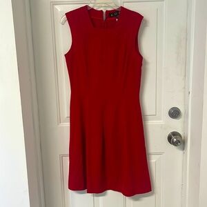 NWT  KOEL size six. Red back zip, square neck.